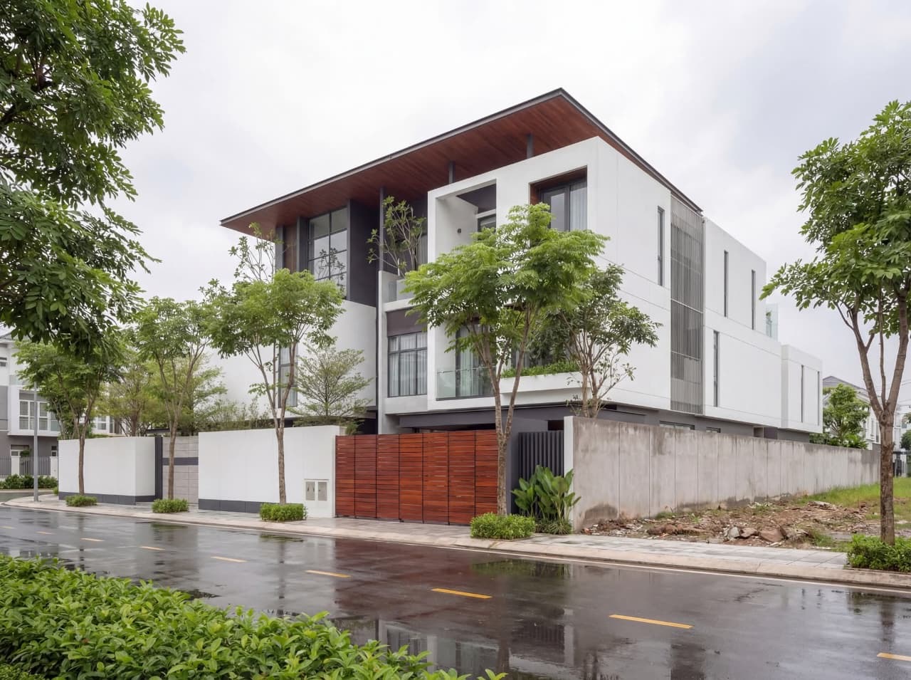 Corner view showing the cantilevered roof and stacked white masses