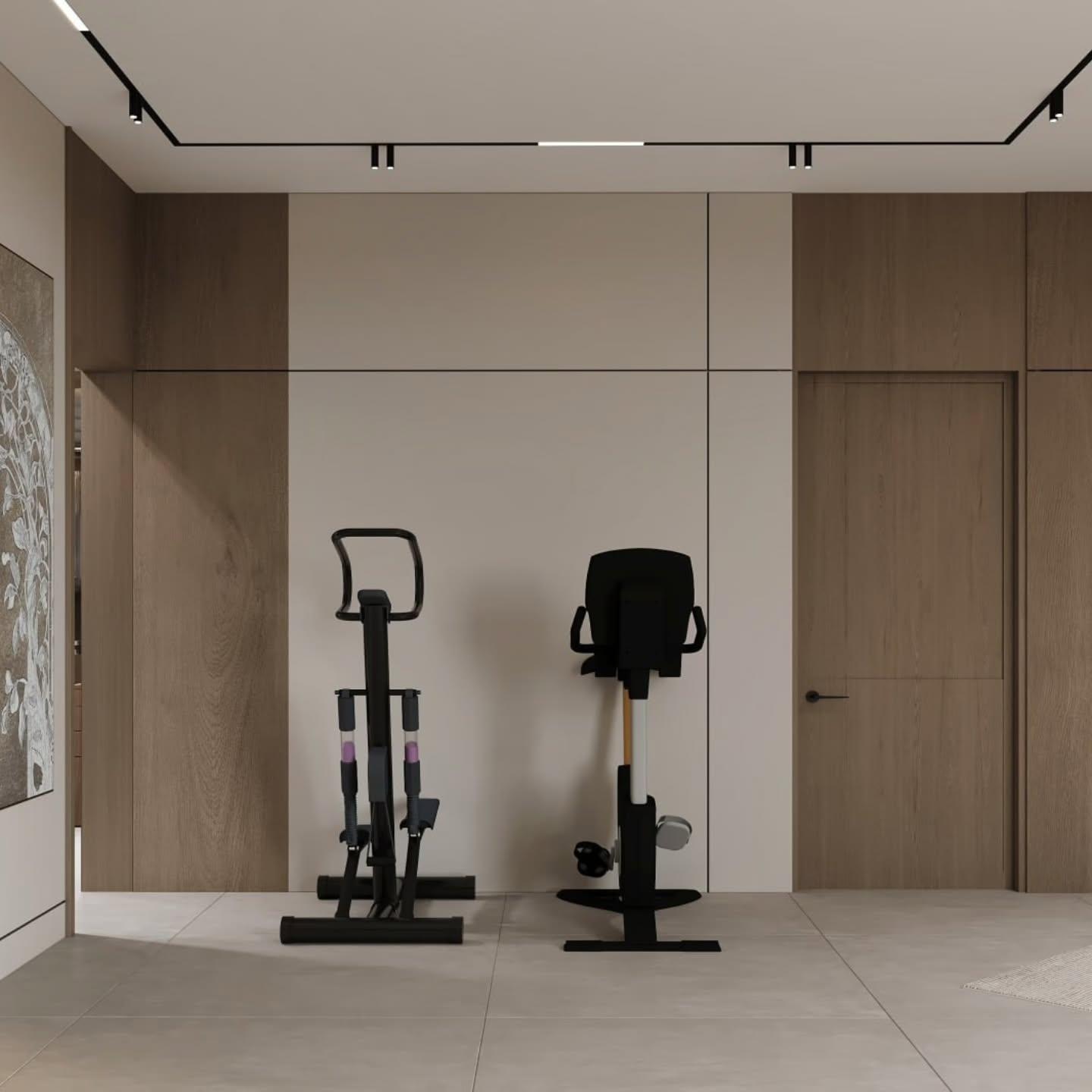 Home gym with two black machines against a wood-panelled wall