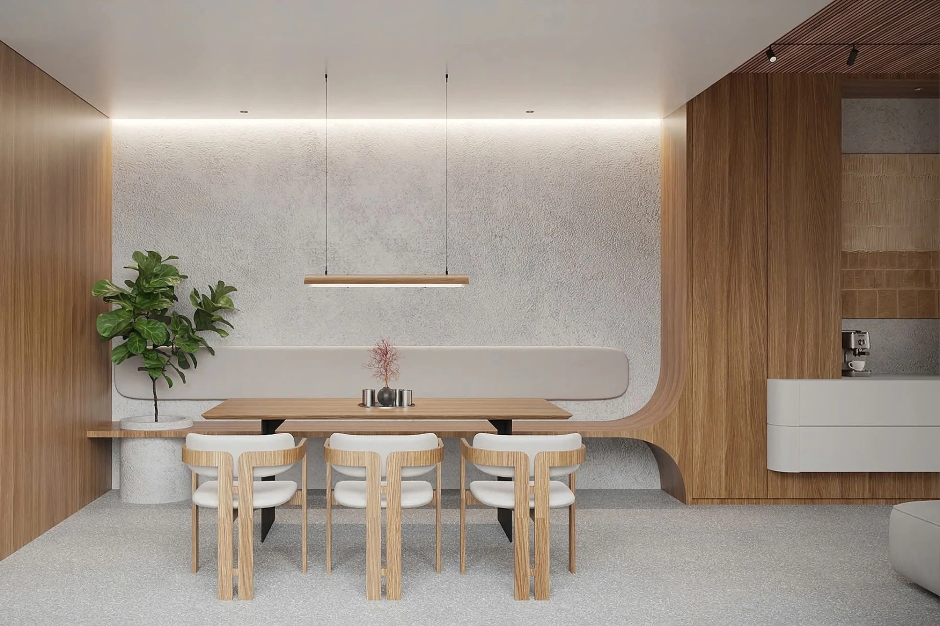 Dining table below a linear pendant against textured plaster