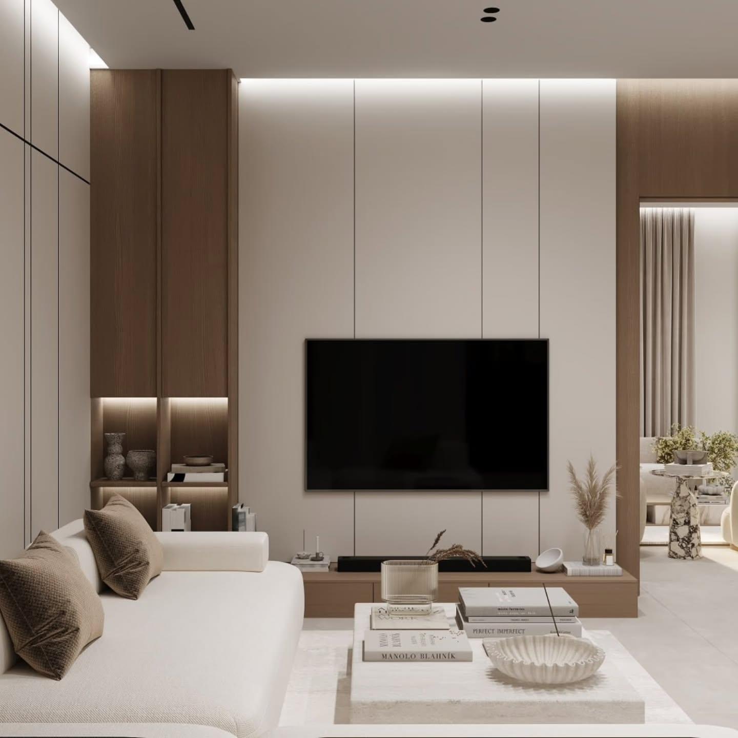 Living room with a wall-mounted screen, white sofa and a stacked stone table