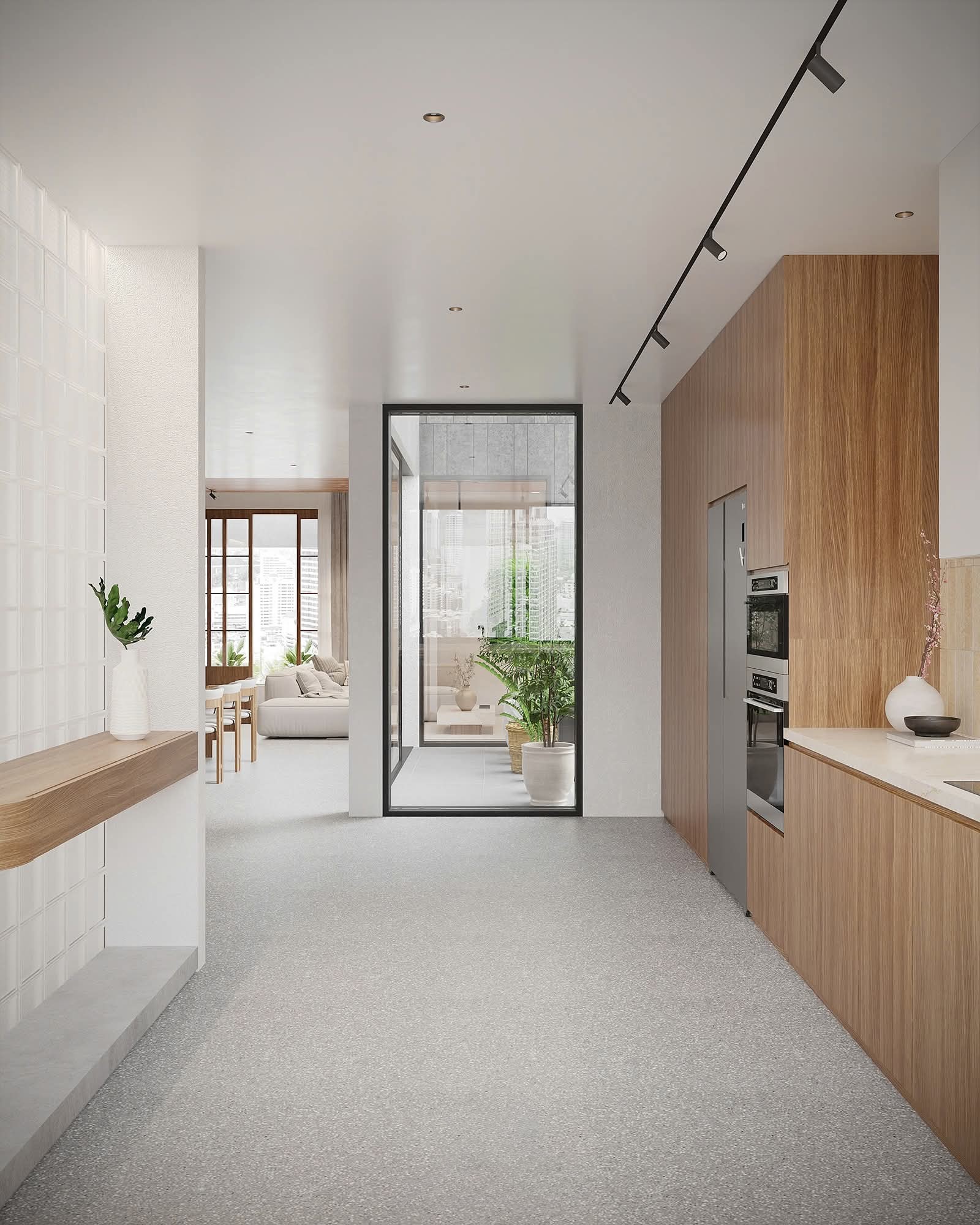 Kitchen in oak with terrazzo floor and a glazed light court