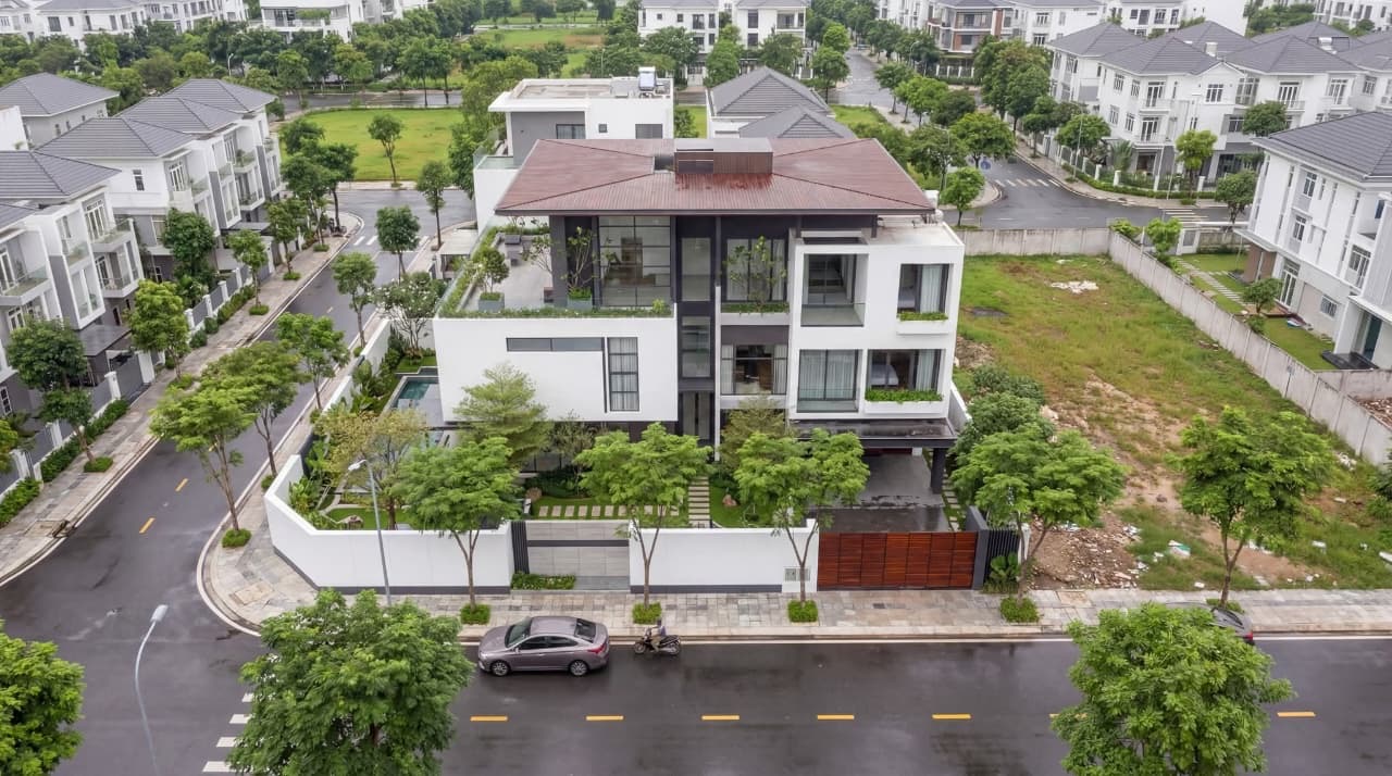 Aerial view of the residence, pool court and landscaped boundary