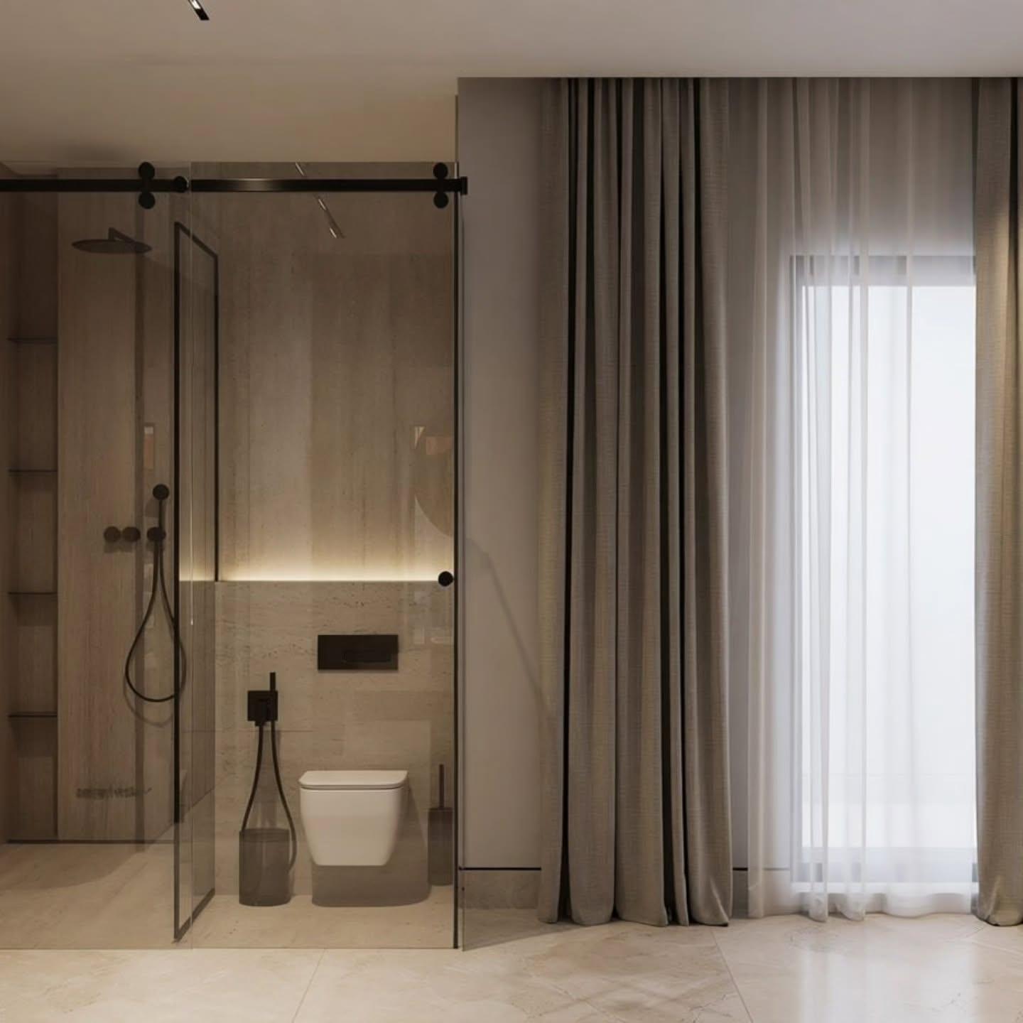 Bathroom with a glass enclosure and full-height sheer curtains