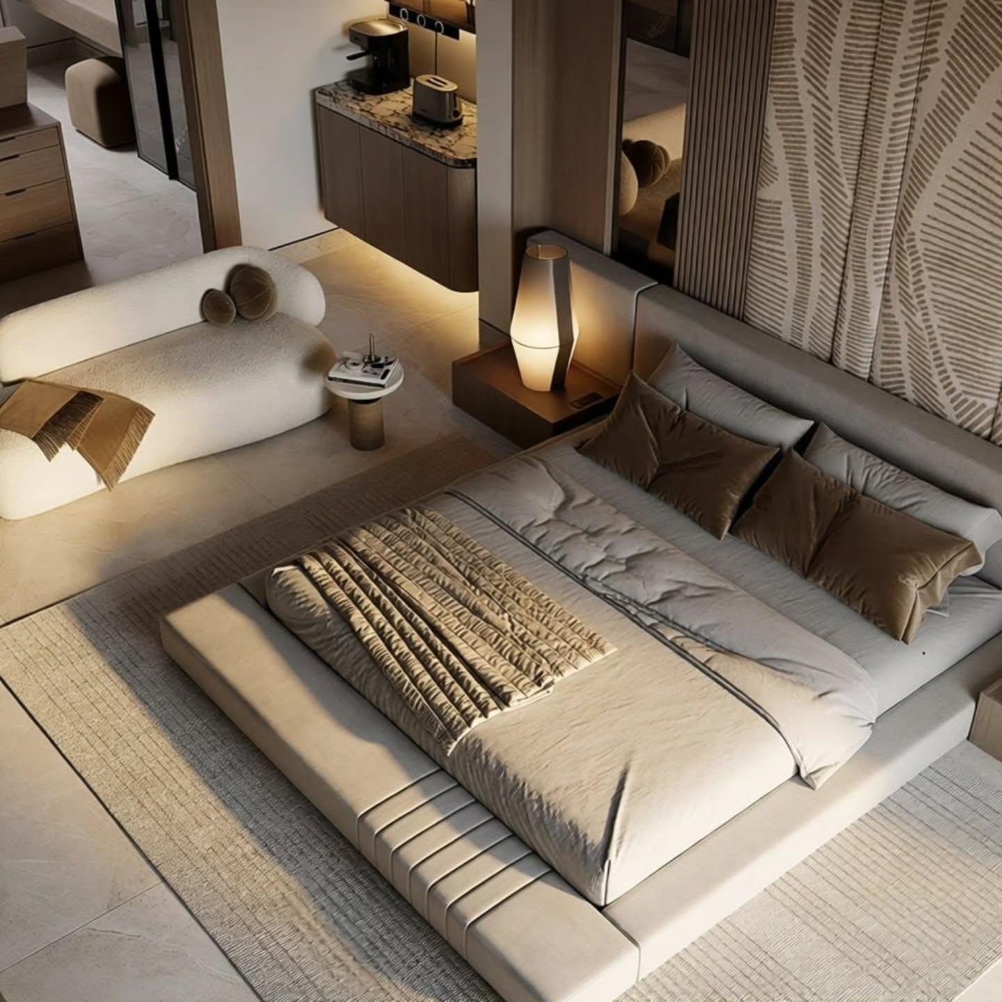 Bedroom seen from above showing the platform bed, chaise and side table