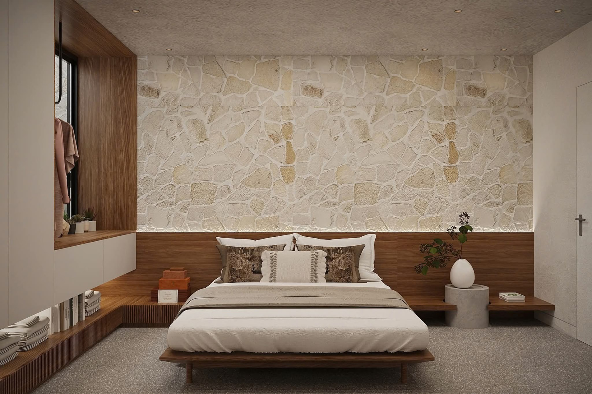 Guest bedroom against a rough-cut stone feature wall