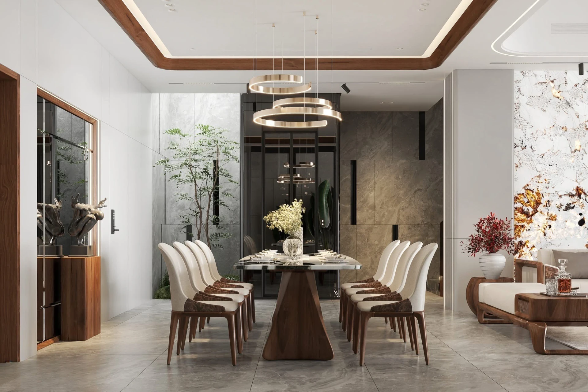 Dining table set with flowers beneath gold pendants against a stone slab wall