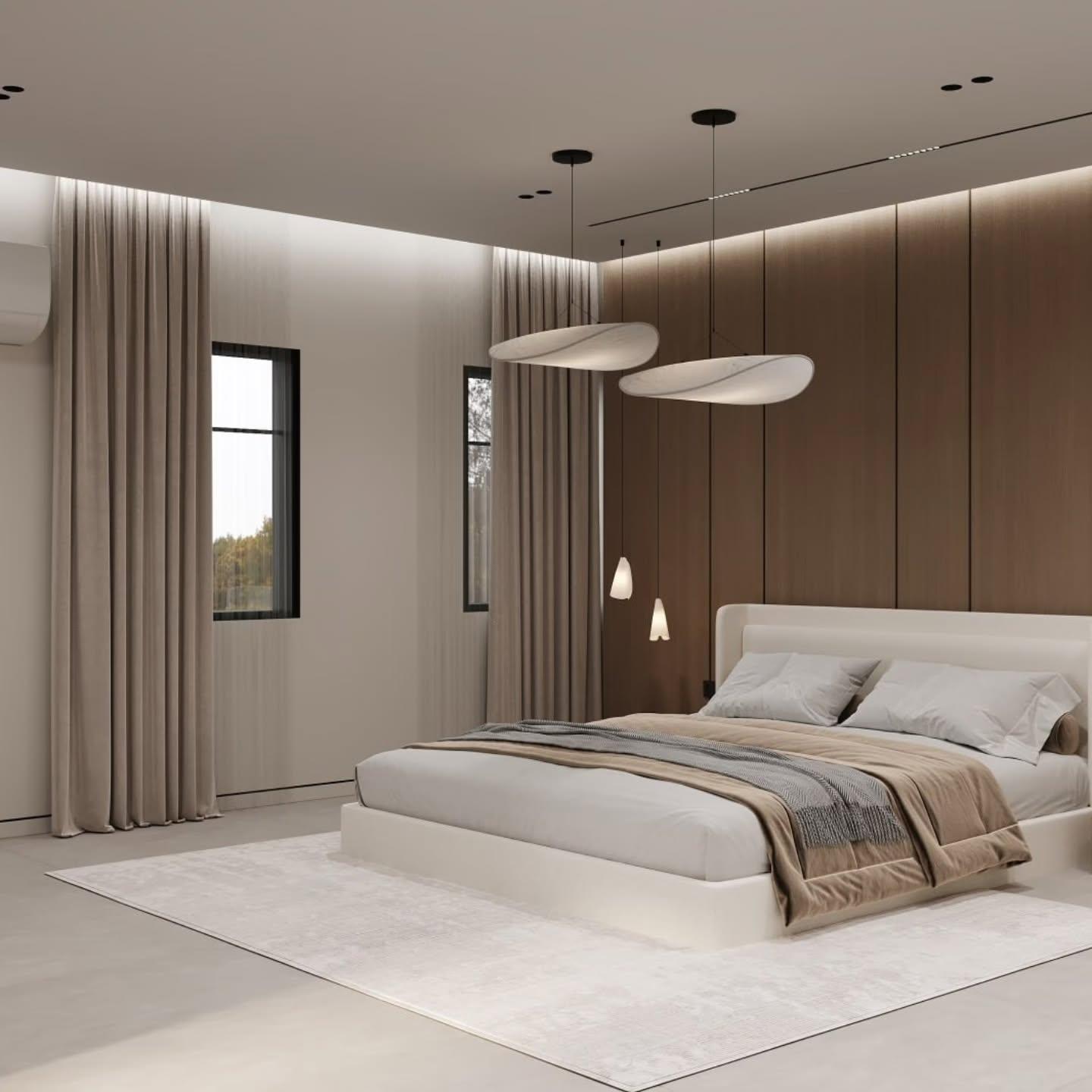 Bedroom with a white bed and leaf-like pendants against a wood-panelled wall