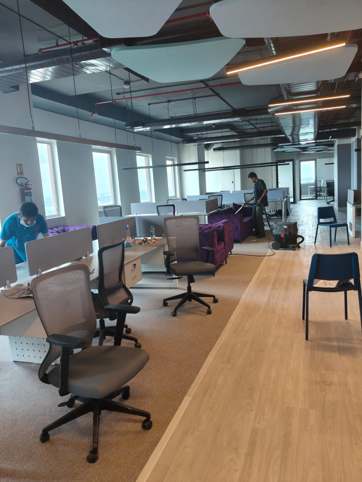 Workspace looking towards the window line with lounge seating and carpet zones