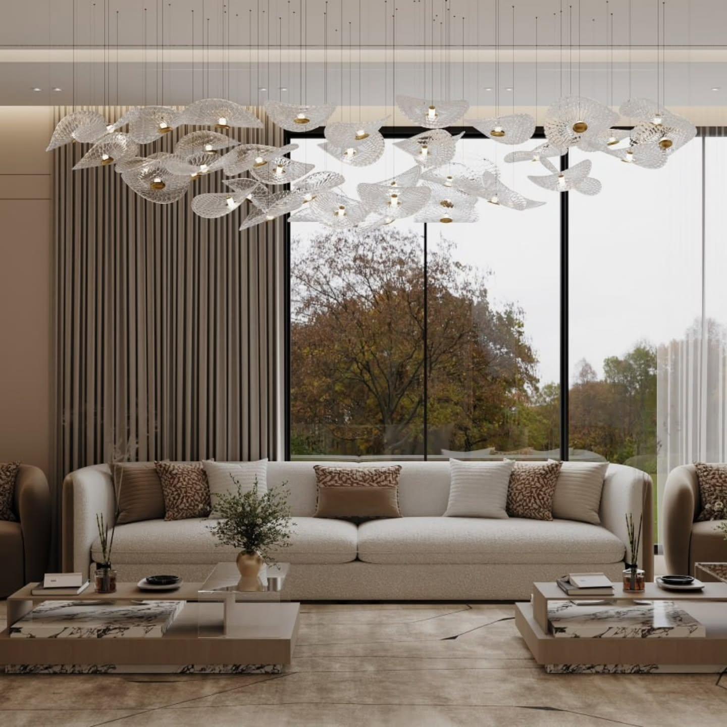 Living room facing full-height glazing with the leaf chandelier and boucle sofas