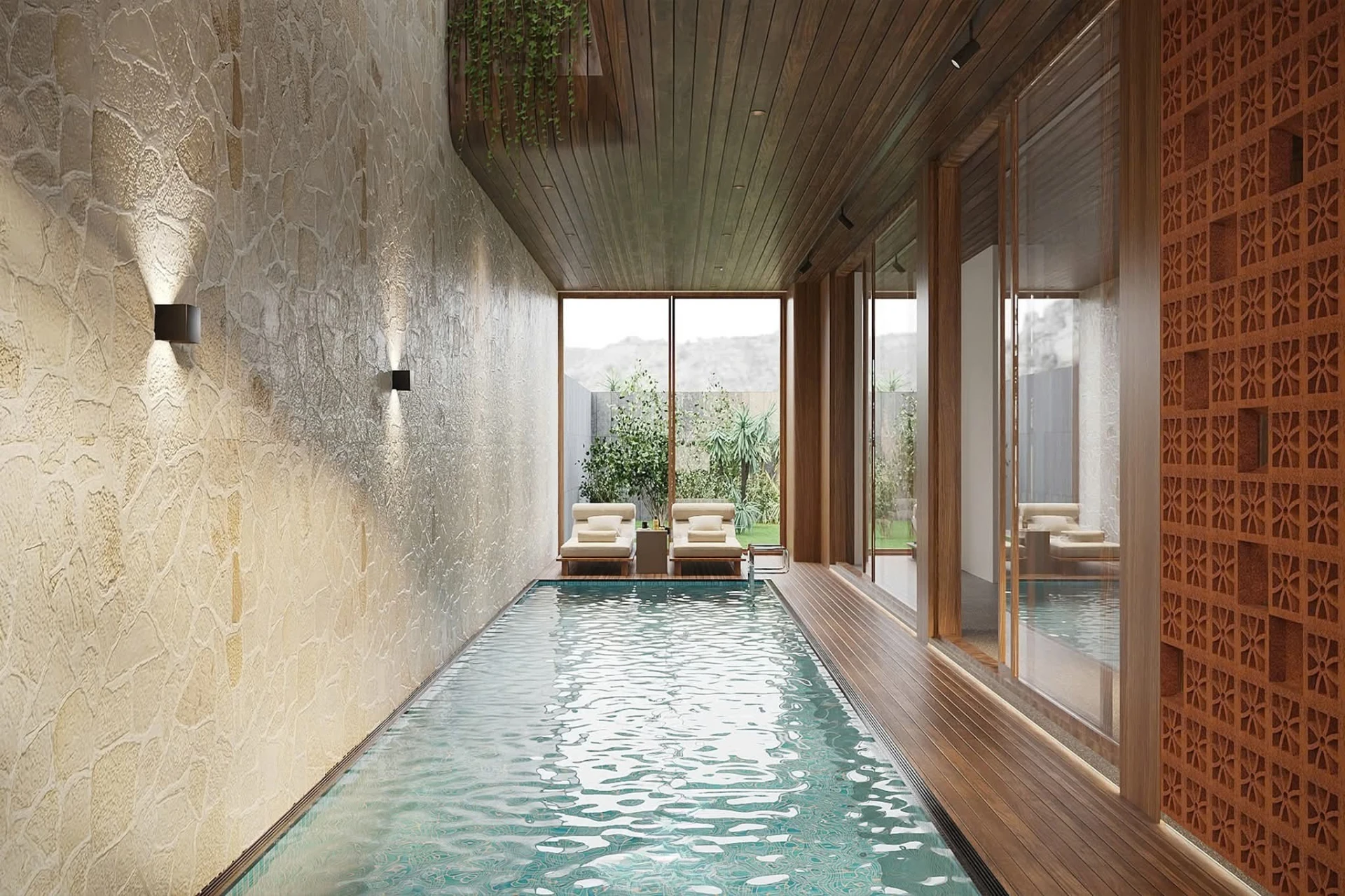 Pool corridor opening to the garden with jaali screen and loungers